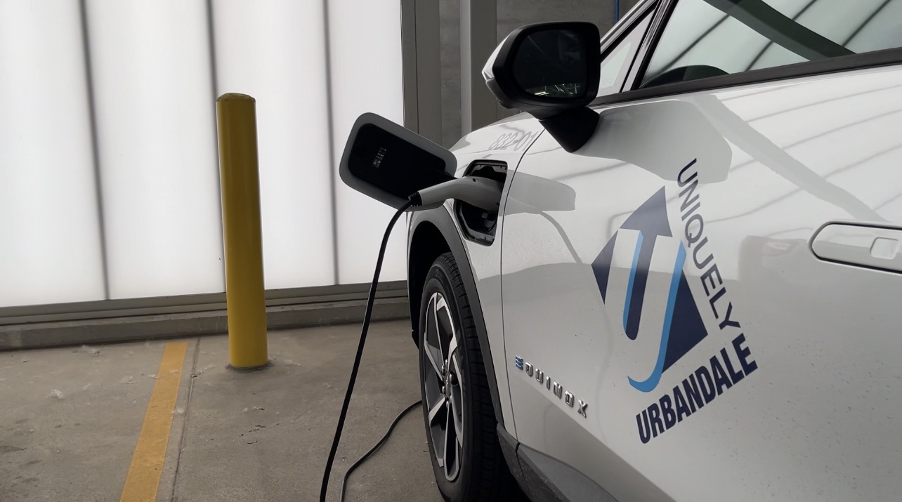 hybrid fleet in Urbandale garage close up with logo